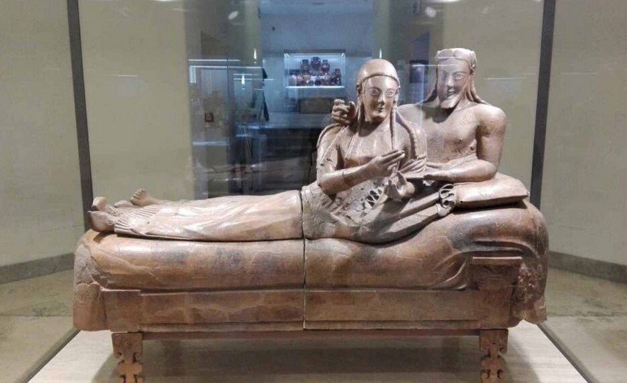 On April 9, 1881, came to light in countless fragments, the Sarcophagus of the Spouses (or Sarcophagus with Reclining Couple) at the Banditaccia necropolis, eastbound, Cerveteri, Italy, c. 530-520 BCE, painted terracotta, 3 feet 9 1/2 inches  x 6 feet 7 inches (at the National Etruscan Museum in Rome's Villa Giulia). Reassembled from about four hundred fragments, the Sarcophagus of the spouses is actually an urn intended to accommodate the material remains of the deceased.